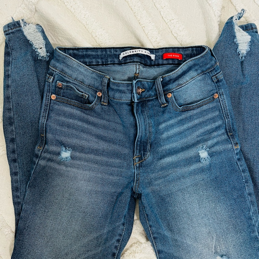 Celebrity pink distressed jeans